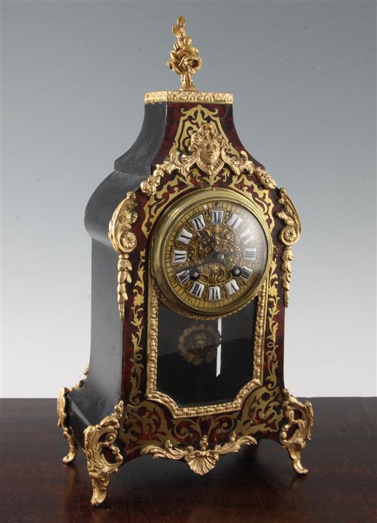 An early 20th century French red boulle mantel clock, 16in.